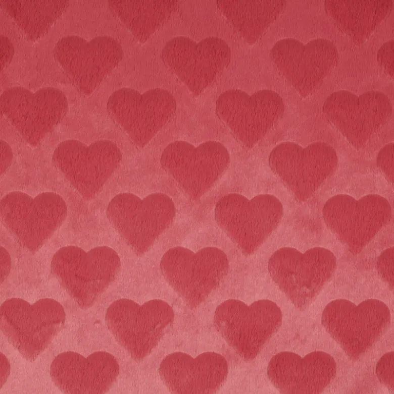 Tissu fausse fourrure structurée motif coeurs - Rose corail