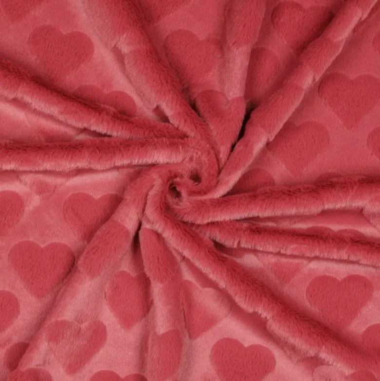 Tissu fausse fourrure structurée motif coeurs - Rose corail