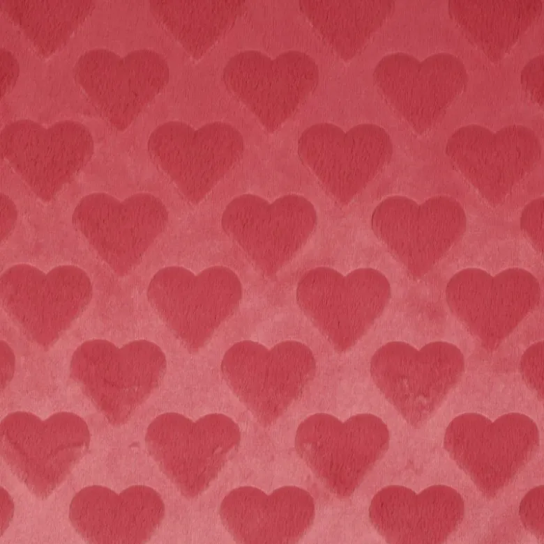 Tissu fausse fourrure structurée motif coeurs - Rose corail