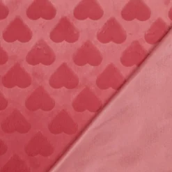 Tissu fausse fourrure structurée motif coeurs - Rose corail