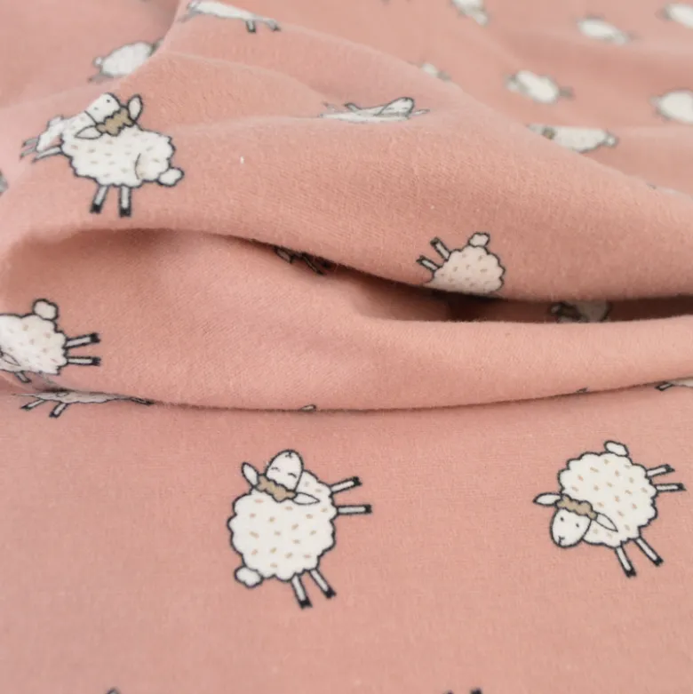 Tissu flanelle de coton Poppy motif moutons fond vieux rose