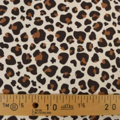 Tissu French Terry coton – Motif léopard caramel fond écru