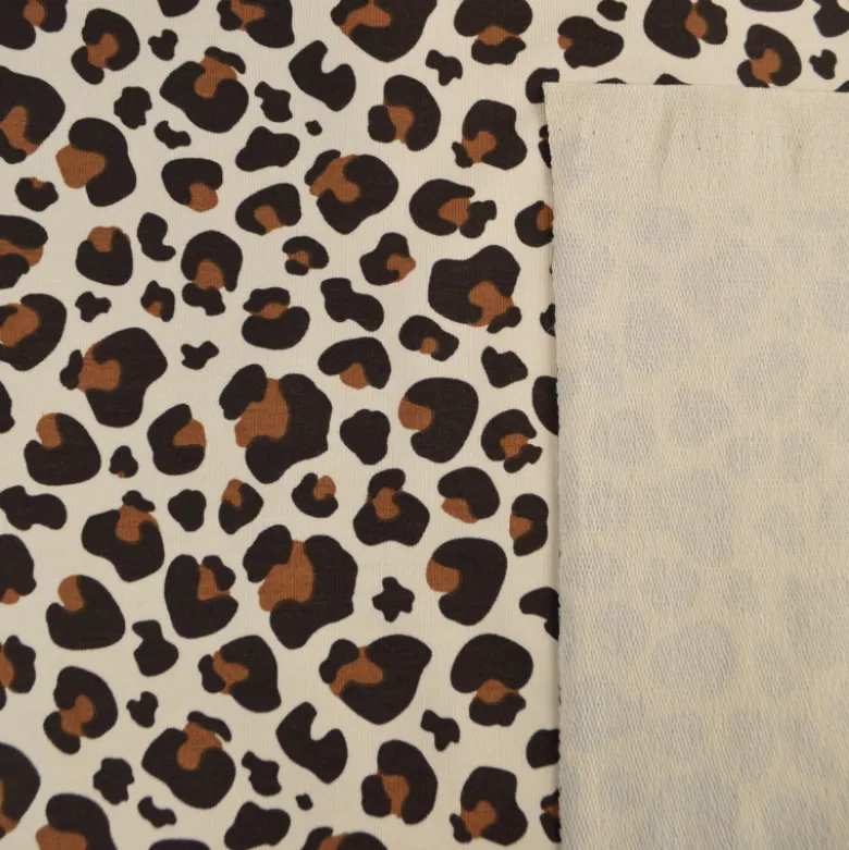 Tissu French Terry coton – Motif léopard caramel fond écru