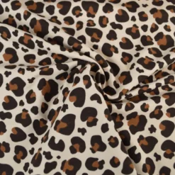 Tissu French Terry coton – Motif léopard caramel fond écru