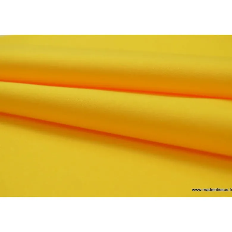 Tissu Gabardine enduite étanche jaune.