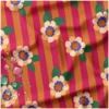 Tissu imperméable Aliny type ciré de pluie motif fleurs et rayures orange et rose