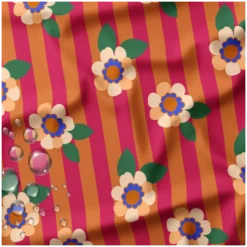 Tissu imperméable Aliny type ciré de pluie motif fleurs et rayures orange et rose