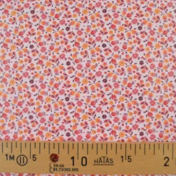 Tissu imperméable Caseille type ciré de pluie motif fleurs fond rose