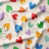 Tissu imperméable Chrichri type ciré motif coeurs multicouleurs