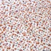 Tissu imperméable Ebbie type ciré motif léopard fond écru