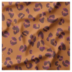 Tissu imperméable Fauve type ciré motif léopard fond marron