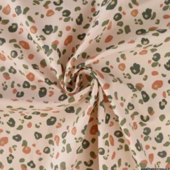 Tissu imperméable Felyna type ciré motif léopard Graou fond écru