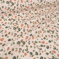 Tissu imperméable Felyna type ciré motif léopard Graou fond écru