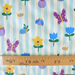 Tissu imperméable Hypolite type ciré de pluie motif fleurs et rayures