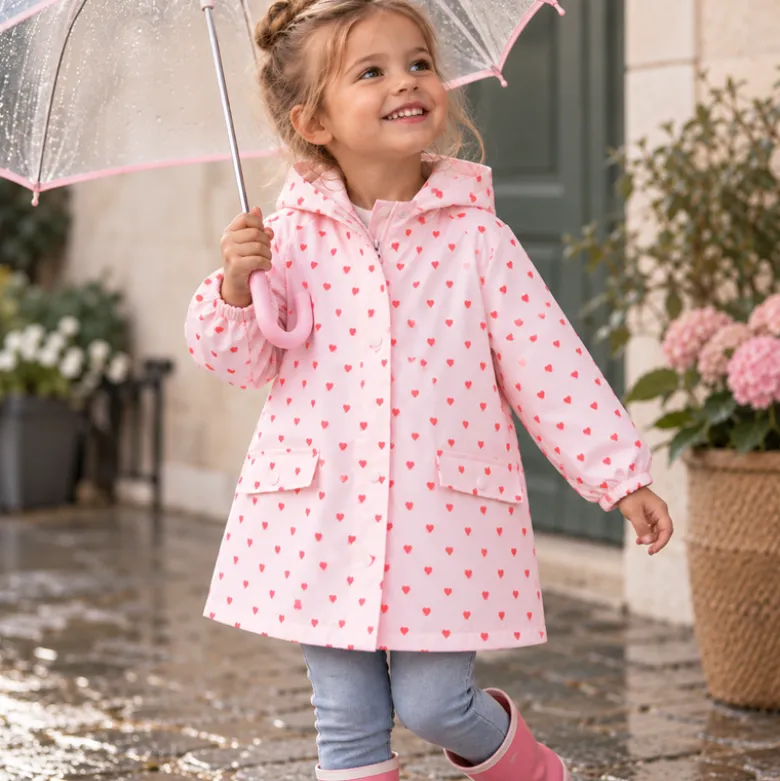 Tissu imperméable Popheart type ciré de pluie motif coeurs fond rose pale