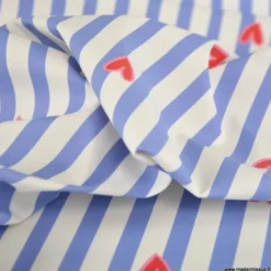 Tissu imperméable Suzette type ciré de pluie motif coeurs et rayures bleues