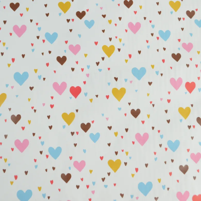 Tissu imperméable Tiamo type ciré de pluie motif coeurs bleus et roses