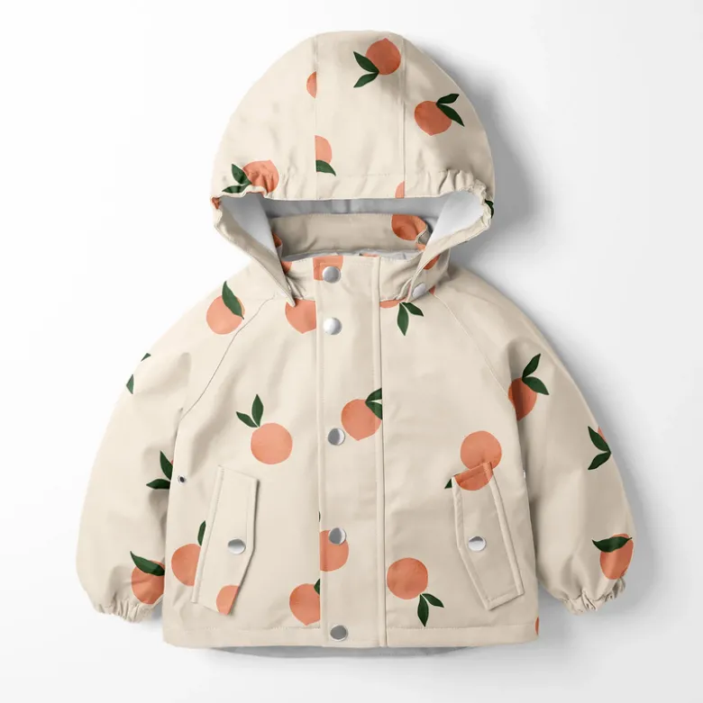 Tissu imperméable type ciré motif fruits fond rose clair