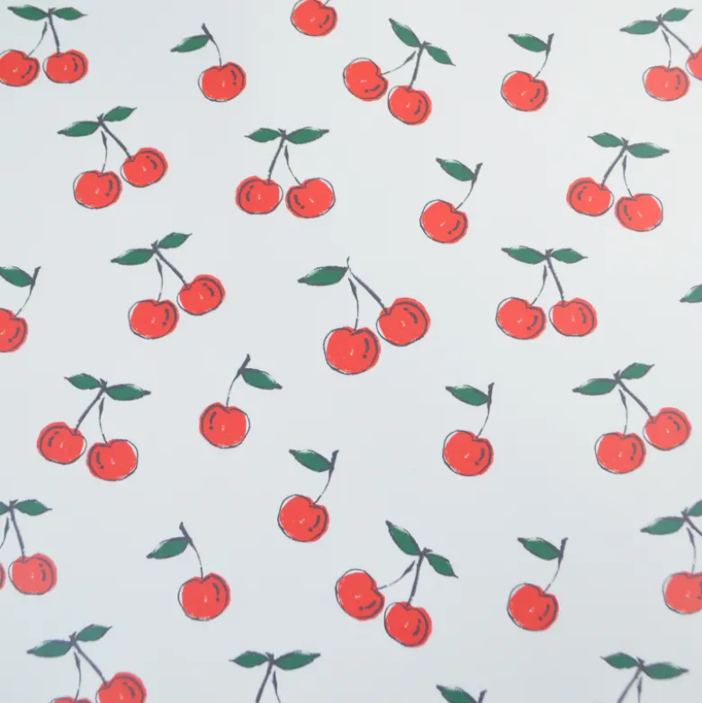 Tissu imperméable type ciré motif cerises fond blanc