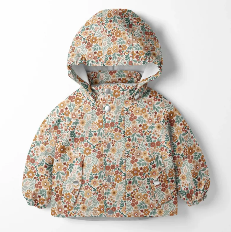 Tissu imperméable type ciré motif fleurs fond blanc cassé