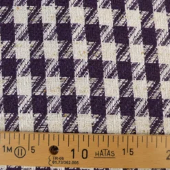 Tissu jacquard effet tweed motif pied-de-poule violet avec fil lurex doré