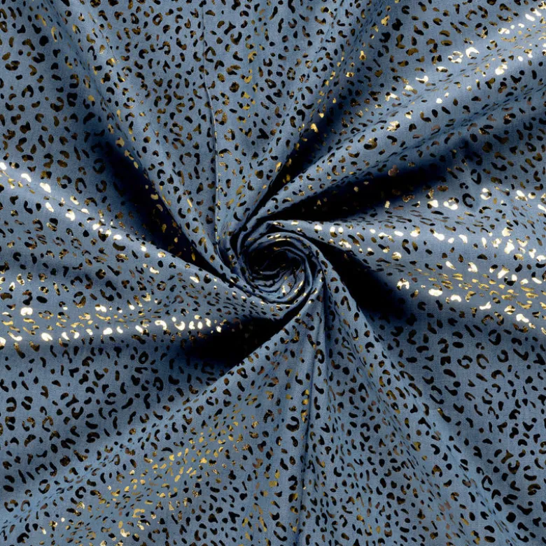 Tissu Jean fin motif Léopard doré fond bleu