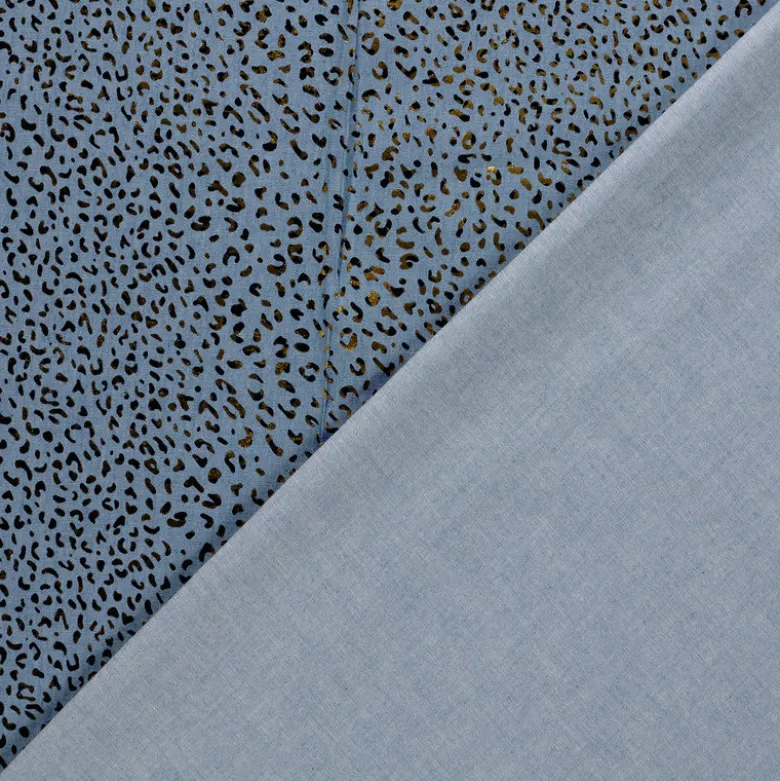 Tissu Jean fin motif Léopard doré fond bleu