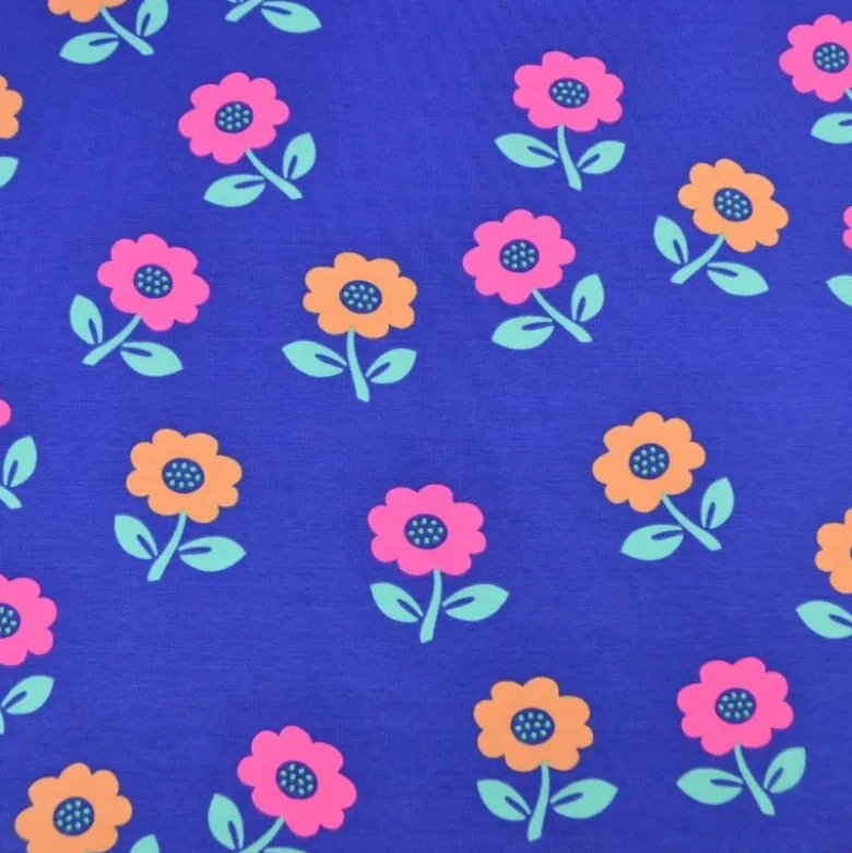 Tissu jersey coton Poppy motif fleurs rose fluo - fond Cobalt