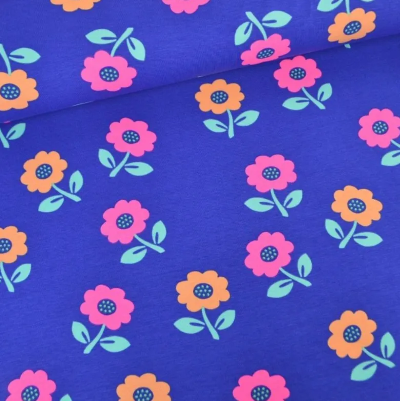 Tissu jersey coton Poppy motif fleurs rose fluo - fond Cobalt