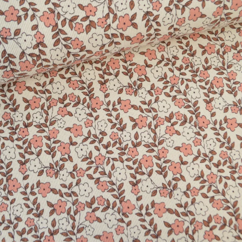 Tissu jersey côtelé bio motif fleurs roses et caramel fond naturel
