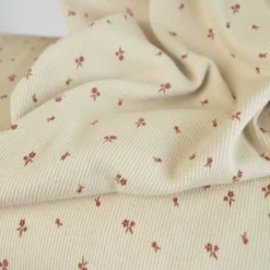 Tissu jersey côtelé fines côtes – Motif fleurs terracotte fond beige