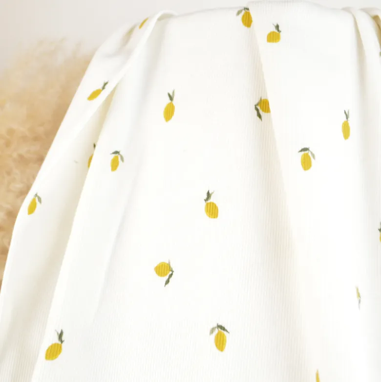 Tissu jersey côtelé fines côtes – Motif citrons fond blanc cassé