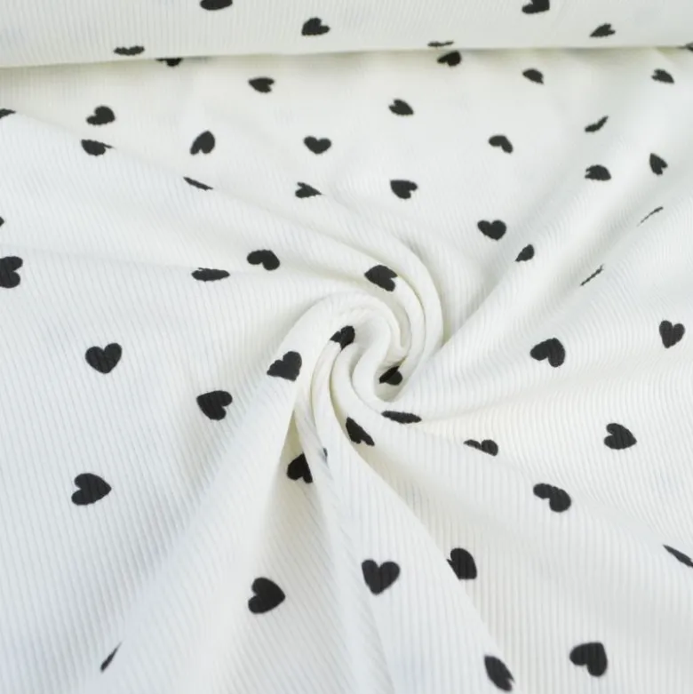 Tissu jersey côtelé motif coeurs Noirs fond blanc