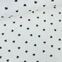 Tissu jersey côtelé motif coeurs Noirs fond blanc