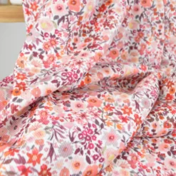 Tissu jersey côtelé motif fleurs automnales roses