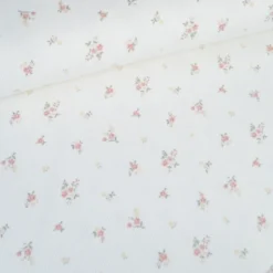 Tissu jersey côtelé motif fleurs roses fond blanc cassé