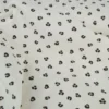 Tissu jersey côtelé motif léopard fond sable