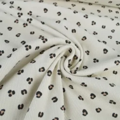 Tissu jersey côtelé motif léopard fond sable