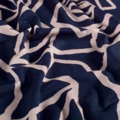 Tissu Jersey de Viscose Vortex motifs fleurs fond marine - OEKO TEX
