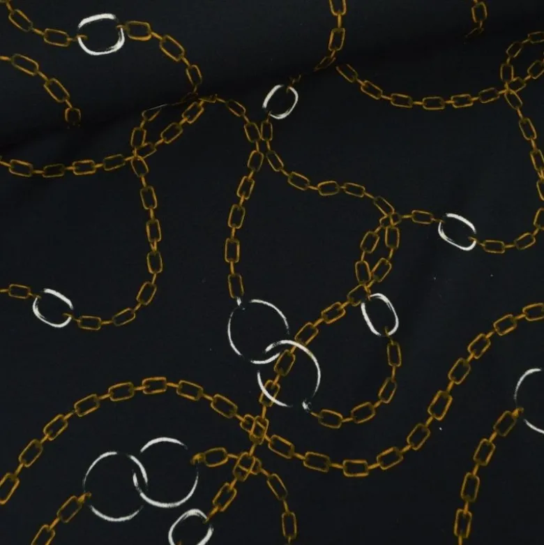 Tissu Jersey milano motif chaines dorés fond noir