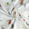 Tissu jersey motif animaux faisant du vélo fond blanc