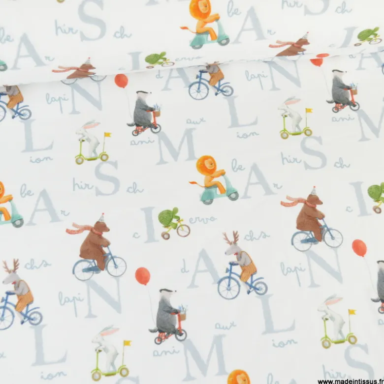 Tissu jersey motif animaux faisant du vélo fond blanc