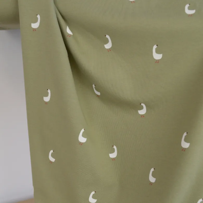Tissu jersey motifs oies sur fond vert kaki - OEKO TEX