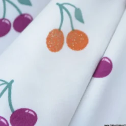 Tissu jersey Poppy motif cerises à paillettes fond blanc - OEKO TEX