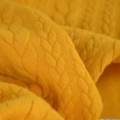 Tissu jersey torsadé jaune moutarde