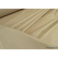 Tissu leger imperméable étanche polyester enduit acrylique beige .