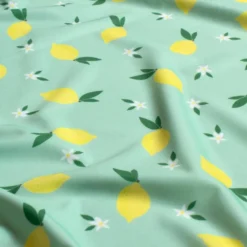 Tissu maillot de bain motif citrons fond vert - OEKO TEX
