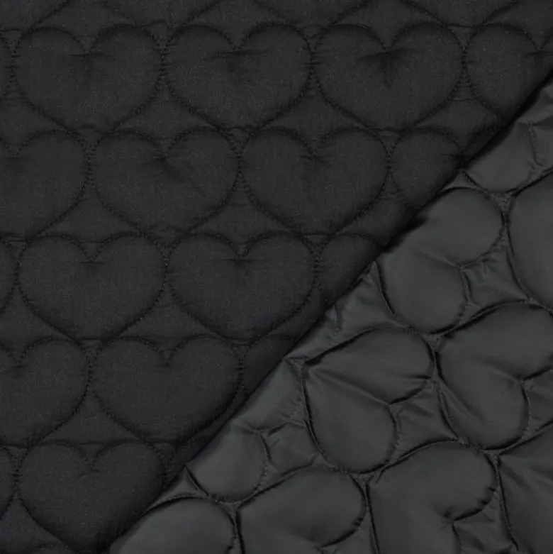 Tissu matelassé Coeurs irisé fond noir