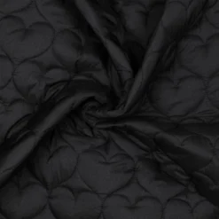 Tissu matelassé Coeurs irisé fond noir
