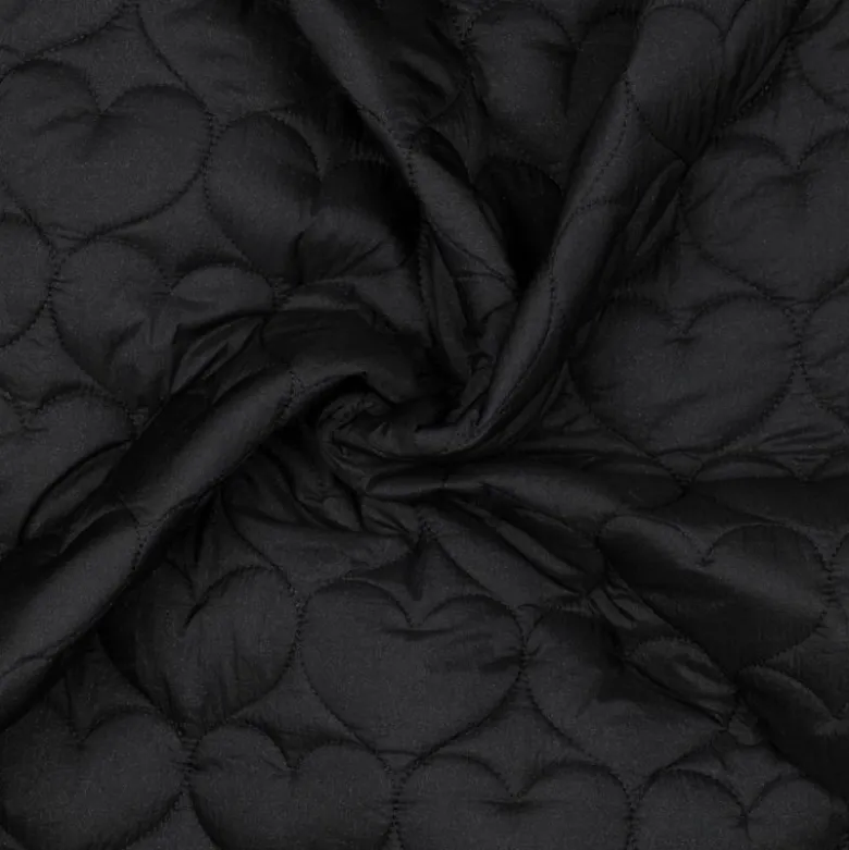 Tissu matelassé Coeurs irisé fond noir